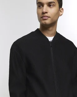 River Island regular fit plisse zip bomber jacket Black Clearance