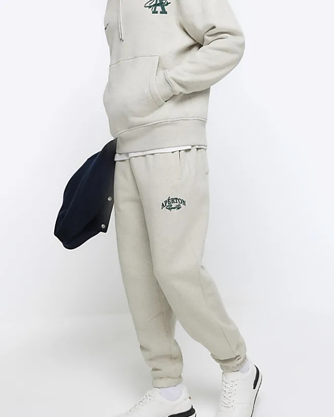 River Island regular fit graphic cuffed joggers Grey Sale