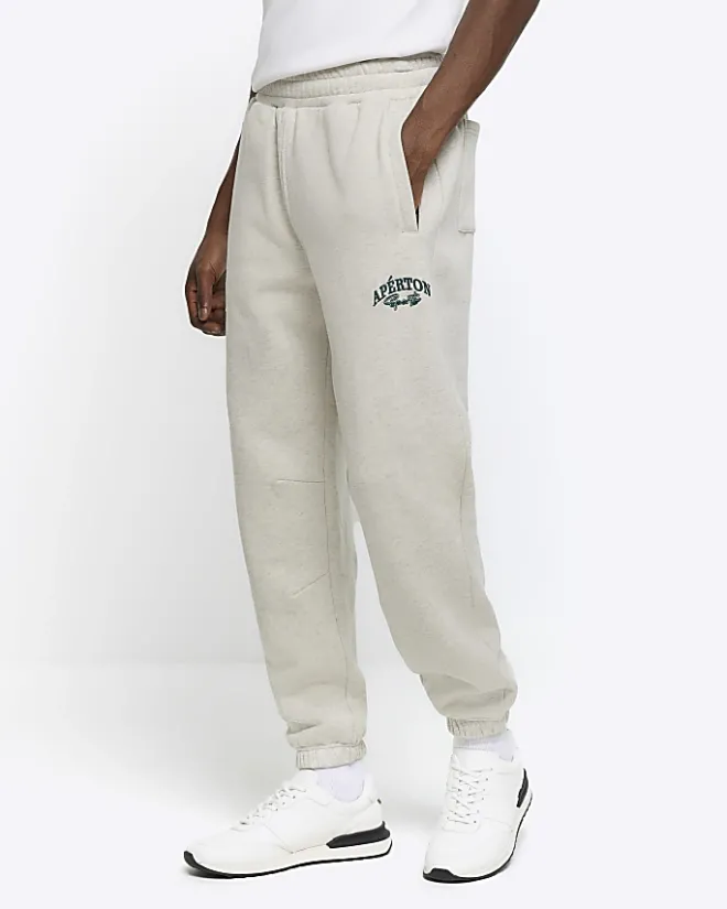 River Island regular fit graphic cuffed joggers Grey Sale