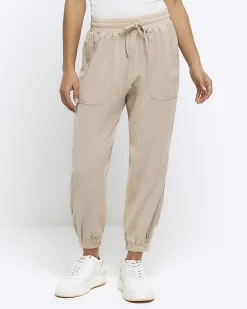 River Island Petite beige lyocell elasticated joggers Cream Fashion