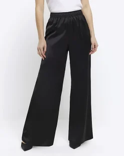 River Island Petite satin wide leg trousers Black Clearance