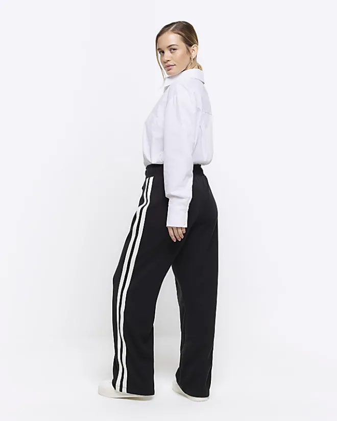 River Island Petite side stripe wide leg joggers Black Fashion